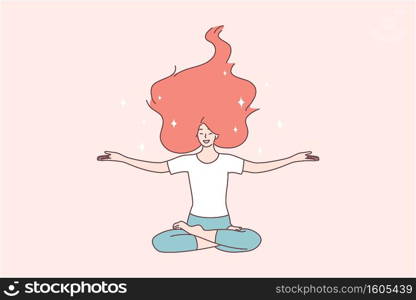 Healthy happy lifestyle, bodycare, harmony concept. Happy woman with red hair sitting on floor with open arms in lotus position, meditating and feeling happy about all news in life . Healthy happy lifestyle, bodycare, harmony concept