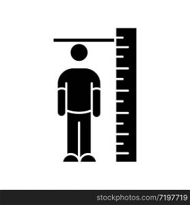 Height measurement black glyph icon. Human body size determination. Tailoring parameters, body growth silhouette symbol on white space. Person standing near huge ruler vector isolated illustration