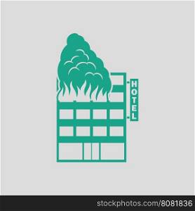 Hotel building in fire icon. Gray background with green. Vector illustration.