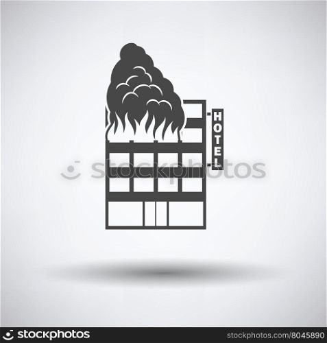 Hotel building in fire icon on gray background with round shadow. Vector illustration.