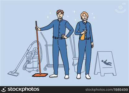Housework and cleaning workers concept. Young smiling woman and man cleaners in blue uniform standing holding tools for cleaning in hands vector illustration . Housework and cleaning workers concept.