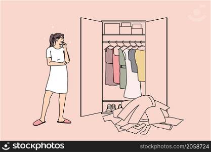 Huge wardrobe and problem of choice concept. Young smiling girl standing looking at wardrobe with many colorful clothes and trying to choose something to wear vector illustration. Huge wardrobe and problem of choice concept