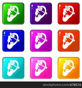 Human ear with piercing icons of 9 color set isolated vector illustration. Human ear with piercing set 9