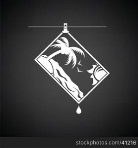 Icon of photograph drying on rope. Black background with white. Vector illustration.