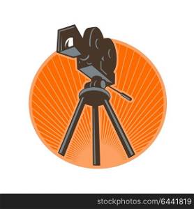 Icon retro style illustration of a Vintage 35mm Motion Picture Camera, film or movie camera set on tripod viewed from low angle worm&rsquo;s eye view set inside circle with sunburst on isolated background.. Vintage 35mm Motion Picture Camera Retro