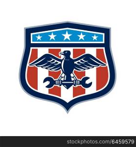 Icon retro style illustration of an American mechanic bald eagle clutching spanner wrench with United States of America USA star spangled banner or stars stripes flag inside crest isolated background.. American Eagle Mechanic USA Flag Crest