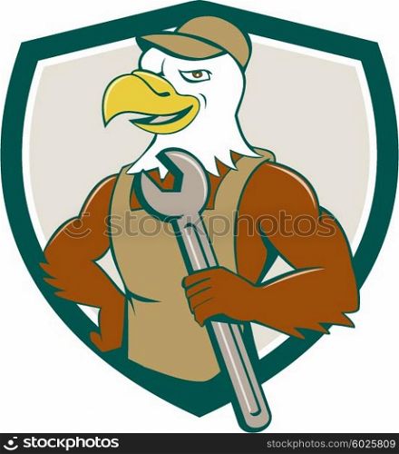 Illustration of a american bald eagle mechanic holding spanner looking to the side with one hand on hips set inside shield crest done in cartoon style. . American Bald Eagle Mechanic Spanner Crest Cartoon