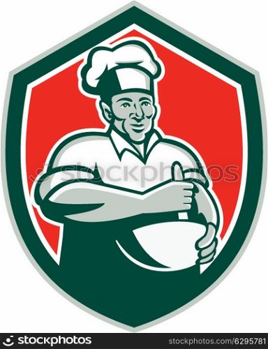 Illustration of a baker chef cook with hat holding a mixing bowl viewed from front set inside shield crest done in retro style on isolated background.. Baker Chef Cook Mixing Bowl Shield Retro