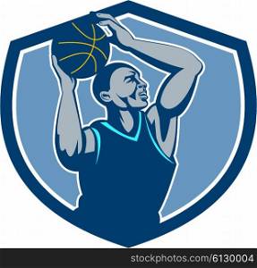 Illustration of a basketball player with ball rebounding lay up set inside shield crest viewed from the side done in retro style.. Basketball Player Rebounding Ball Crest Retro