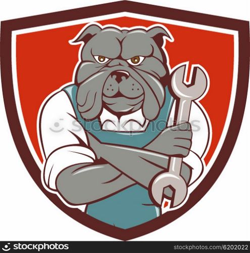 Illustration of a bulldog mechanic with arms crossed holding spanner facing front set inside shield crest on isolated background done in cartoon style.. Bulldog Mechanic Arms Crossed Spanner Crest Cartoon