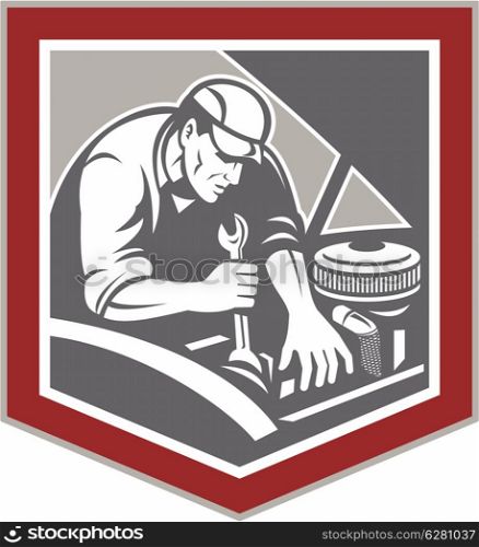 Illustration of a car mechanic repairing automobile vehicle using spanner wrench set inside shield crest shape done in retro woodcut style style.. Car Mechanic Repair Automobile Shield Retro