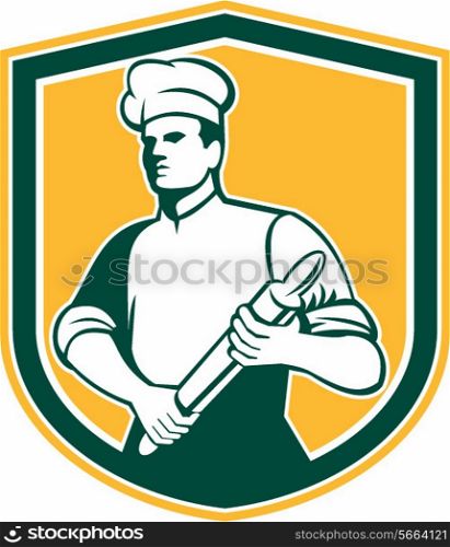 Illustration of a chef cook baker holding rolling pin looking to the side set inside shield crest done in retro style.. Chef Cook Rolling Pin Shield Retro