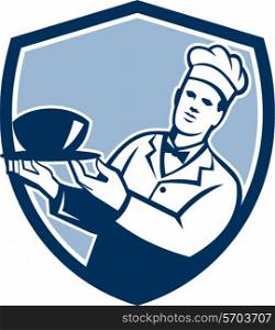 Illustration of a chef cook holding bowl serving set inside shield crest on isolated background done in retro style. . Chef Cook Holding Serving Bowl Shield Retro