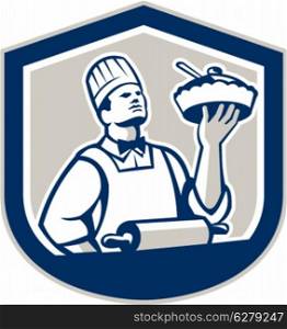 Illustration of a chef, cook or baker holding up pie pastry with roller in foreground facing front set inside shield crest on isolated background done in retro style.