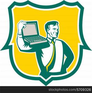 Illustration of a computer geek technician man carrying computer laptop on shoulder looking to the side set inside shield on isolated background done in retro style.