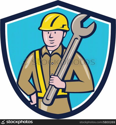 Illustration of a construction worker wearing hard hat holding giant spanner set inside shield crest on isolated background done in cartoon style. . Construction Worker Spanner Shield Cartoon