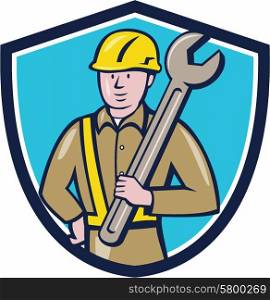 Illustration of a construction worker wearing hard hat holding giant spanner set inside shield crest on isolated background done in cartoon style. . Construction Worker Spanner Shield Cartoon