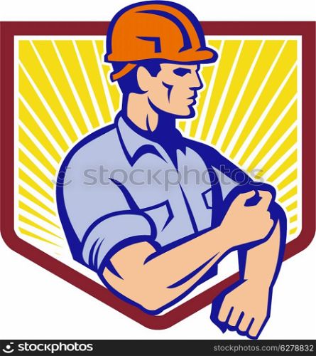 Illustration of a construction worker wearing hardhat rolling up sleeve facing side set inside shield done in retro style. Construction Worker Rolling Up Sleeve Retro