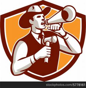 Illustration of a cowboy auctioneer holding bullhorn and gavel shouting announcing viewed from the side on isolated background set inside shield crest done in retro style.