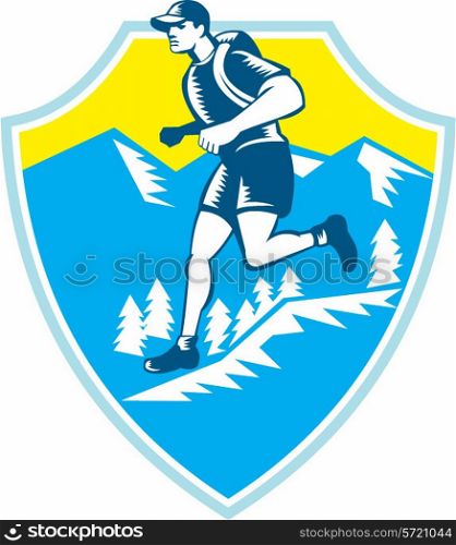 Illustration of a cross country runner running viewed from the side set inside shield crest with mountains and trees in the background done in retro style.. Cross Country Runner Mountains Shield Woodcut