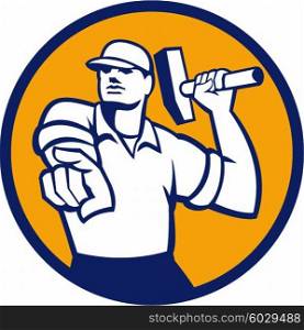 Illustration of a demolition worker wearing hat pointing holding hammer ready to strike set inside circle on isolated background done in retro style.. Demolition Worker Hammer Pointing Circle Retro
