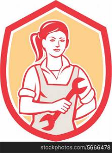 Illustration of a female mechanic holding spanner viewed from the front set inside shield crest on isolated background done in retro style. . Female Mechanic Spanner Shield Retro