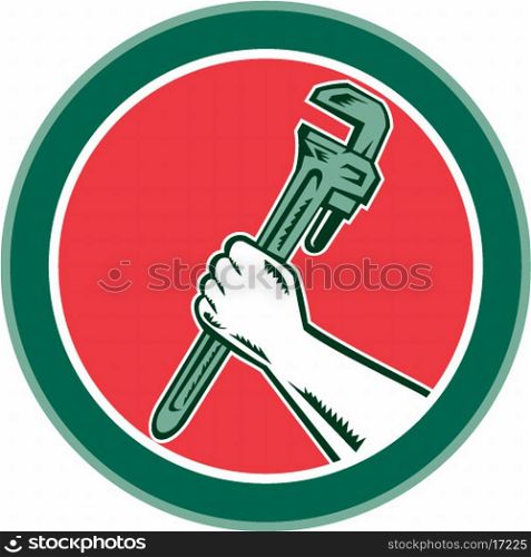 Illustration of a hand holding an adjustable monkey wrench set inside circle on isolated background done in retro woodcut style.
