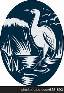 illustration of a Heron wading in the marsh or swamp done in retro woodcut style.. Heron wading in the marsh or swamp