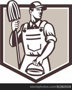 Illustration of a janitor cleaner worker holding mop and water bucket pail viewed from low angle set inside shield done in retro style.. Janitor Cleaner Holding Mop Bucket Shield Retro
