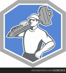Illustration of a locksmith standing front side view carrying key on shoulder set inside shield crest on isolated background done in retro style. Locksmith Carry Key Shield Retro