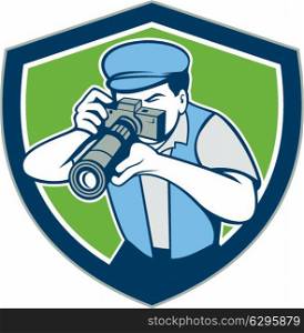 Illustration of a photographer shooting aiming with vintage camera set inside shield crest on isolated background done in cartoon style.. Photographer Shooting Camera Shield Retro
