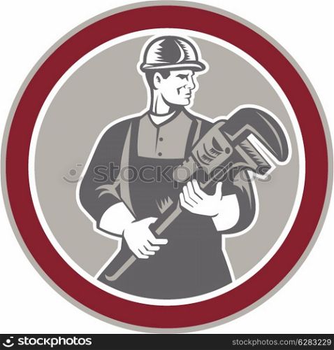 Illustration of a plumber holding a giant monkey wrench set inside circle facing front done in retro woodcut style on isolated background.. Plumber Holding Giant Wrench Woodcut Circle