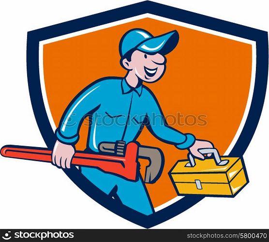 Illustration of a plumber in overalls and hat carrying monkey wrench and toolbox viewed from the side set inside shield crest on isolated background done in cartoon style. . Plumber Carrying Monkey Wrench Toolbox Shield