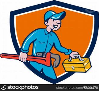 Illustration of a plumber in overalls and hat carrying monkey wrench and toolbox viewed from the side set inside shield crest on isolated background done in cartoon style. . Plumber Carrying Monkey Wrench Toolbox Shield