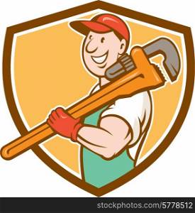 Illustration of a plumber in overalls and hat smiling holding monkey wrench on shoulder set inside shield crest shape on isolated background done in cartoon style.. Plumber Smiling Holding Monkey Wrench Crest