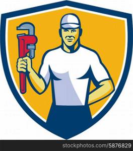 Illustration of a plumber wearing hat holding monkey wrench facing front set inside shield crest on isolated background done in retro style. . Plumber Holding Monkey Wrench Shield Retro