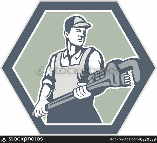 Illustration of a plumber with plumbing monkey wrench set inside hexagon facing front done in retro woodcut style on isolated background.. Plumber Holding Plumbing Wrench Retro