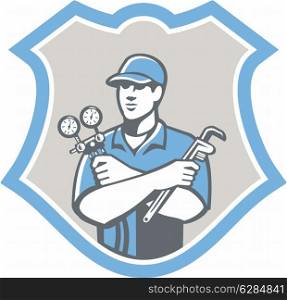 Illustration of a refrigeration and air conditioning mechanic holding a pressure temperature gauge and ac manifold wrench front view set inside shield on isolated on background done in retro style. Refrigeration Air Conditioning Mechanic Shield Retro