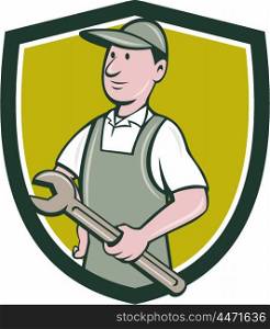 Illustration of a repairman handyman worker wearing hat and overalls holding spanner wrench looking to the side viewed from front set inside shield crest done in cartoon style. . Repairman Holding Spanner Crest Cartoon