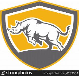 Illustration of a rhinoceros charging side view set inside shield crest shape on isolated background done in retro style.. Rhinoceros Charging Side Shield Retro