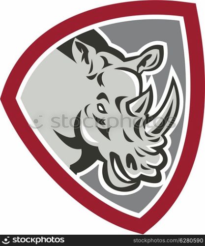 Illustration of a rhinoceros head charging side view set inside shield crest shape on isolated background done in retro style.. Rhinoceros Head Side Shield