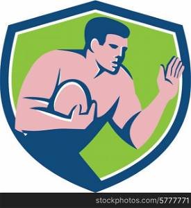 Illustration of a rugby player holding ball fending fend off with hand out set viewed from the side inside shield crest on isolated background done in retro style.. Rugby Player Ball Fend Off Shield Retro