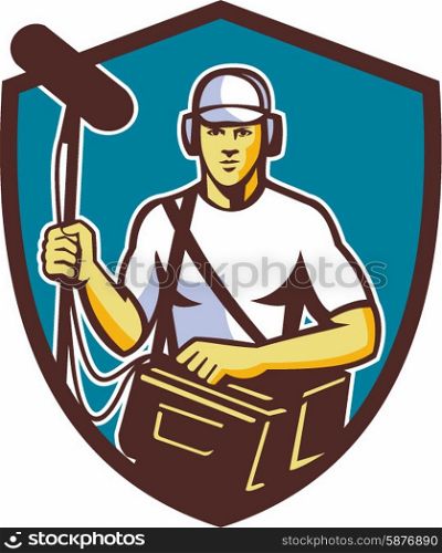 Illustration of a soundman film crew worker with headphone carrying bag holding a telescopic microphone facing front set inside shield crest on isolated background done in retro style.. Soundman Film Crew Microphone Crest Retro