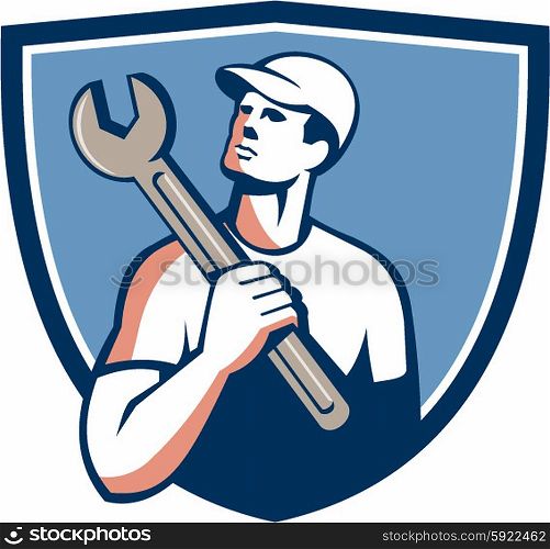 Illustration of a tradesman mechanic wearing hat holding spanner on shoulder looking up to the side set inside shield crest on isolated background done in retro style. . Tradesman Mechanic Spanner Crest Retro