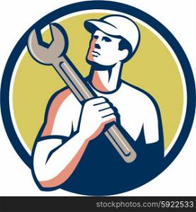 Illustration of a tradesman mechanic wearing hat holding spanner on shoulder looking up to the side set inside circle on isolated background done in retro style. . Tradesman Mechanic Spanner Circle Retro