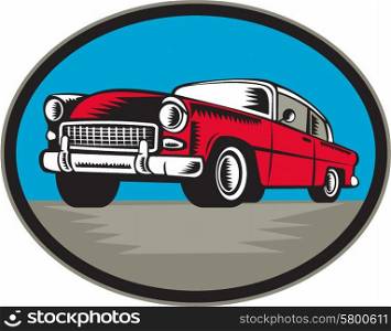 Illustration of a vintage classic car viewed from low angle set inside oval shape done in retro woodcut style.. Vintage Classic Car Low Angle Woodcut