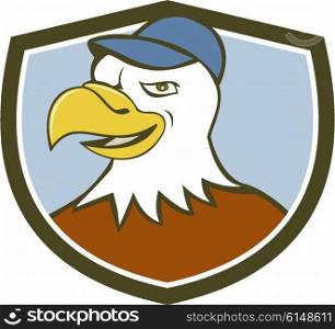 Illustration of an american bald eagle head wearing hat smiling looking to the side set inside shield crest on isolated background done in cartoon style.. American Bald Eagle Head Smiling Shield Cartoon
