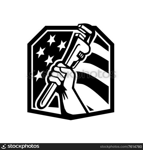 Illustration of an American plumber hand clutching adjustable pipe wrench or monkey wrench viewed from the side set inside shield crest with usa stars and stripes flag in the background done in retro style. . American Plumber Hand Holding a Pipe Wrench USA Flag Crest Black and White Retro