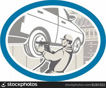 Illustration of an automotive mechanic changing repairing automobile car vehicle tire in workshop garage set inside oval shape done in retro style.. Mechanic Changing Car Tire Repair Retro