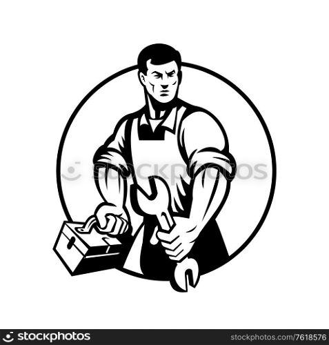 Illustration of an automotive mechanic or aircraft, electrical mechanic holding a spanner or wrench and toolbox viewed from front on isolated background done in retro black and white style.. Automotive Mechanic Holding Spanner and Toolbox Circle Retro Black and White